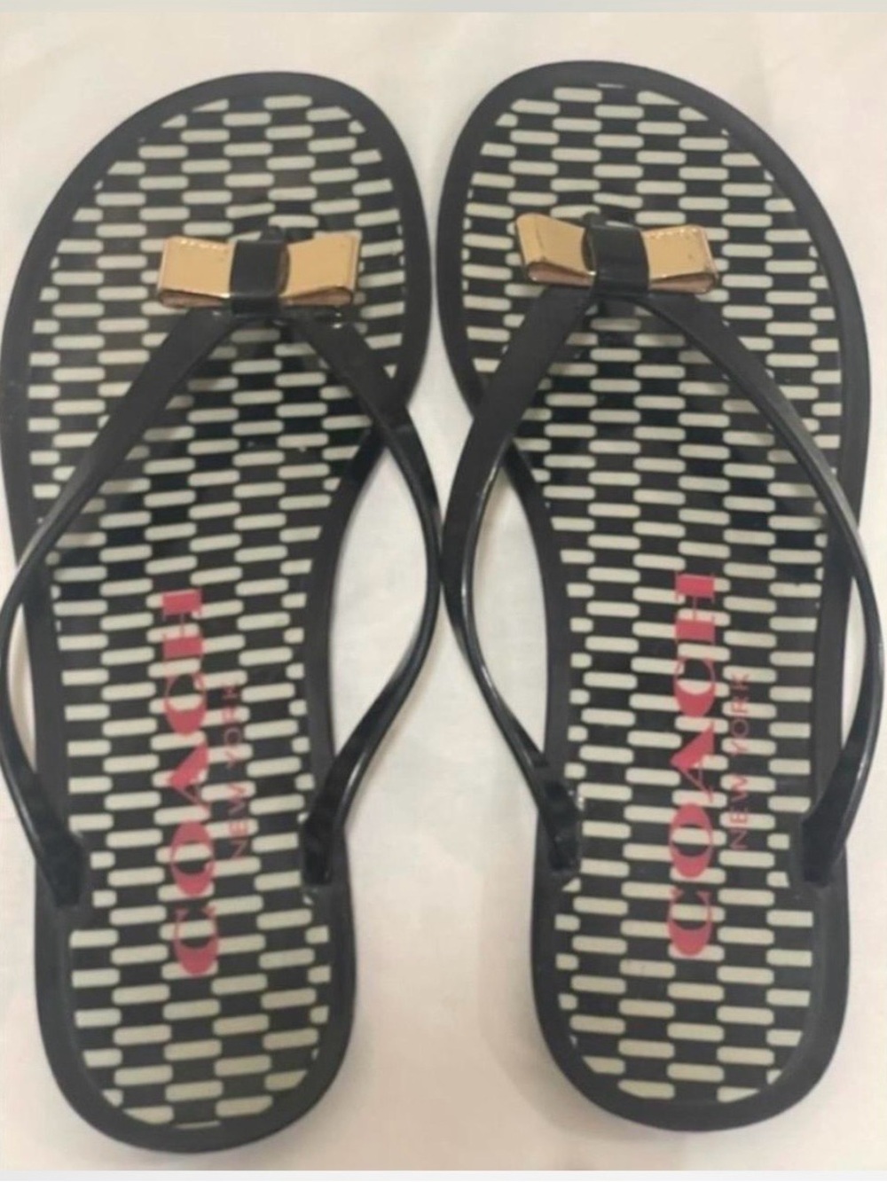 Coach Black and Gold Bow Jelly Flip Sandals
